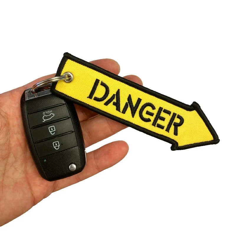Nyckelband - DANGER - Gul pil - Action King