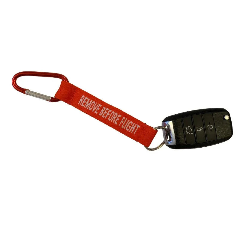 Nyckelband - REMOVE BEFORE FLIGHT - Röd/Vit - Karbinhake - Action King